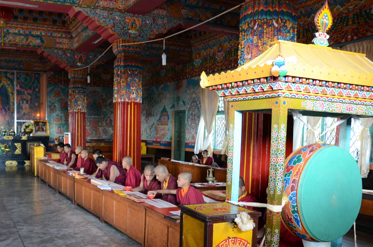 Pokhara Karma Dubgyu Chokhorling Monastery 09 Monks In The Main Prayer Hall With Drum and Painted Pillars and Walls 